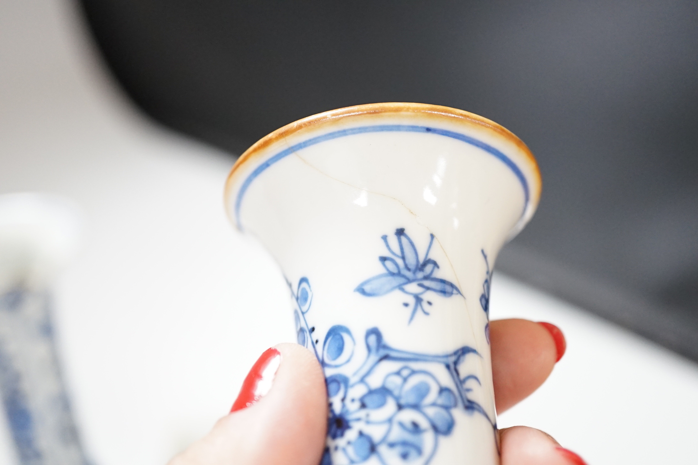 Three Chinese blue and white vases and a wucai square box, one with inscription, 18th century and later, tallest 14cm high